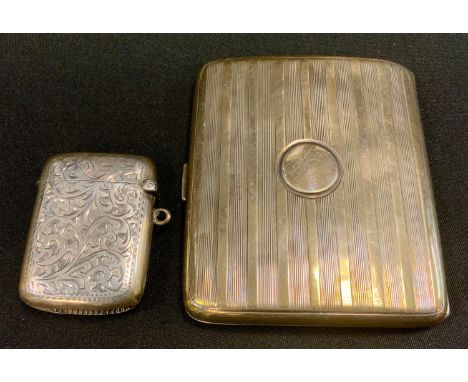 A silver cigarettes case, Birmingham 1923;  a silver vesta case, 3.5oz 