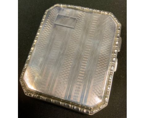 A silver cigarette case, engine turned, 8.5cm long, Chester 1928, 2.3 
