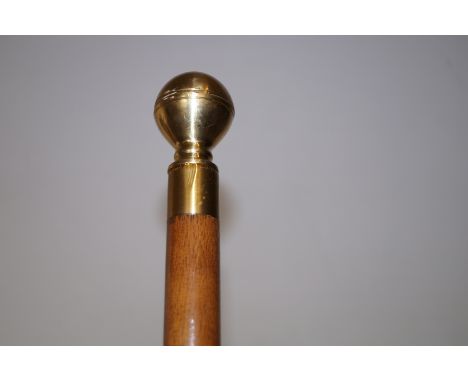 Walking stick with brass finial, enclosing a whisky flask