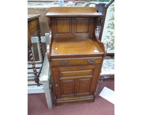 An Early XX Century Oak Cabinet with low back, single shelf, panelled back, base with a single drawer, over cupboard door on 