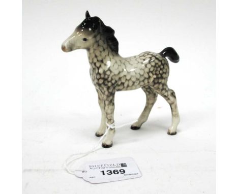 Beswick Foal, in rocking horse grey, 11cm high.Light crackle to glaze, chip to ear, no other damage or restoration - see imag