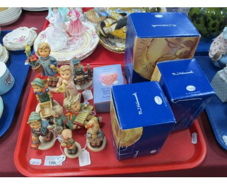 Nine Hummel Goebel figures to include Let's Sing, Little Landscaper, etc. with four relevant boxes. One TraySome light wear t