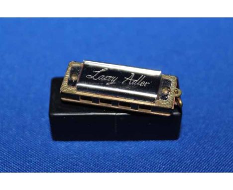 LARRY ADLER MINIATURE HARMONICA BY HOHNER with Adler's hand written autograph also a small group of First Day Covers two sign