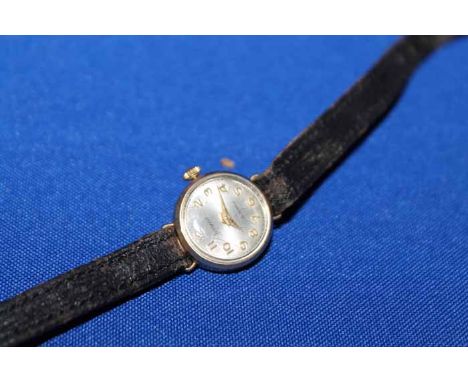 LADY'S ACCURIST MANUAL WIND WRIST WATCHthe round dial with gold coloured Arabic numerals, the case 13mm, on a leather strap