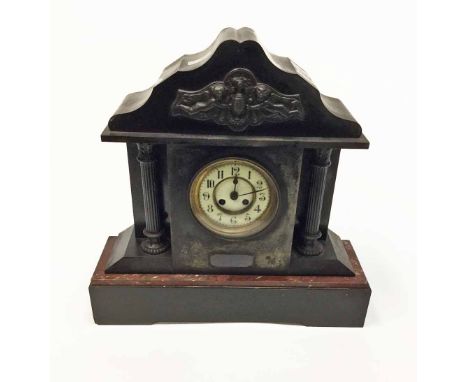 LATE VICTORIAN ARCHITECTURAL SLATE AND MARBLE MANTEL CLOCKthe enamel circular chapter ring with Arabic numerals, the two trai
