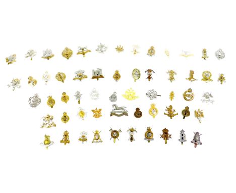 A collection of fifty-seven British army cavalry badges, including XXII Dragoons and VI Dragoons Carabiniers cap badges, Roya
