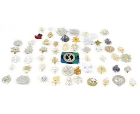 Fifty-seven British army badges, including some territorial army badges, Tyneside Scottish, Isle of Wight Rifles, and Robin H