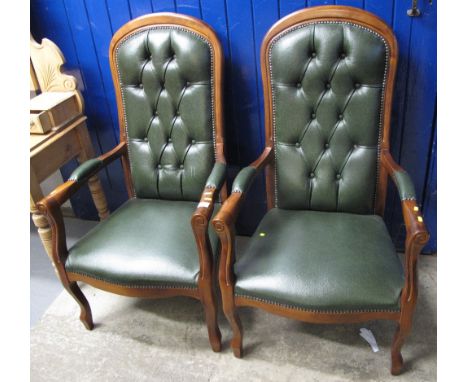 A pair of reproduction mahogany button back upholstered carver armchairs. (2)