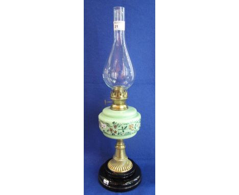 Early 20th Century single brass oil lamp with painted ceramic reservoir and brass pedestal on ceramic base with clear chimney