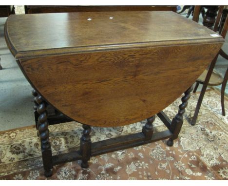 Early 20th Century oak barley twist gate legged table.