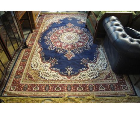 Persian style blue ground floral decorated carpet.