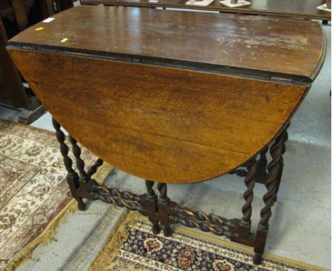 Early 20th Century oak barley twist gate legged table. 