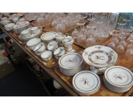 Four trays of Theodore Haviland, Limoges, France porcelain teaware items on a white ground with exotic birds amongst foliage 