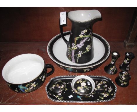 T Forester Ltd phoenix ware 'Asia' design black ground jug and basin with dressing table set. Printed marks. 