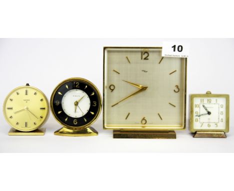 An Imhoff 1970's mantle clock, H. 13cm, together with three alarm clocks.