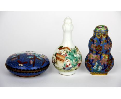 A Chinese cloisonne on copper ink box, Dia. 6.5cm, together with a cloisonne snuff bottle and a porcelain snuff bottle.