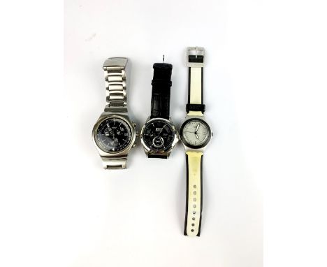 Two Swatch watches and a Citizen watch.