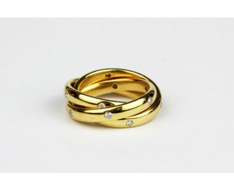 A yellow metal (tested high carat gold) Russian wedding ring set with brilliant cut diamonds, (J.5).