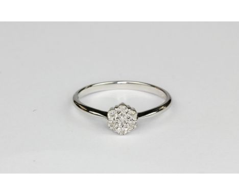 A 9ct white gold diamond set cluster ring, (M.5).