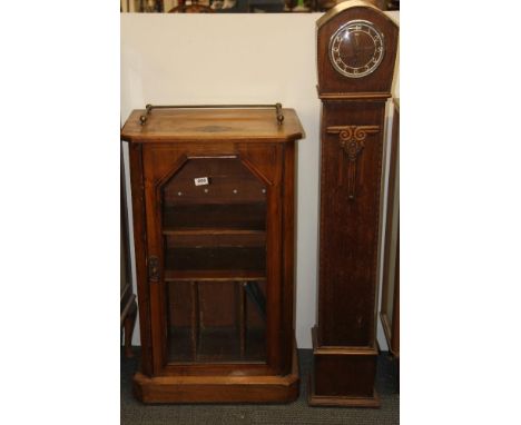 A 1920's walnut veneered record cabinet with gilt brass gallery, 54 x 55 x 94cm. Together with oak granddaughter clock.