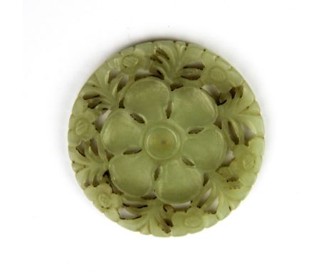 A 19th / early 20th century Chinese carved double sided nephrite jade flower panel, Dia. 5.5cm.