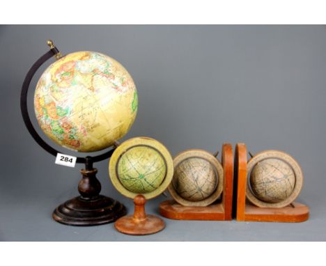 A vintage globe with a  pair of globe bookends and a further small globe, largest 34cm.