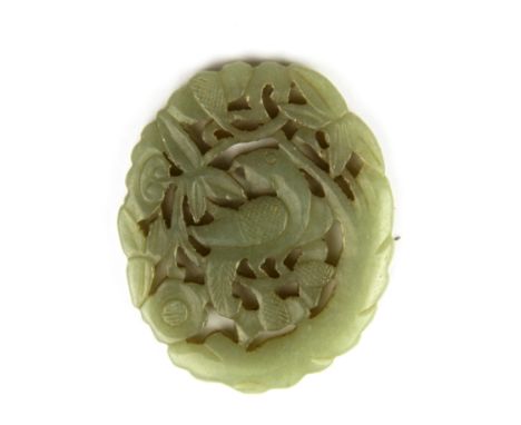 A Chinese carved nephrite jade amulet of a bird among flowers, H. 6.5cm.