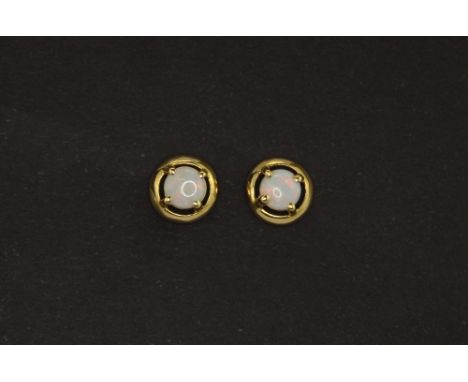 A pair of 18ct yellow gold (stamped 750) opal set stud earrings.