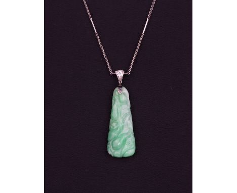 A white metal (tested high carat gold) pendant and chain set with a carved jadeite jade and diamonds, L. 4.5cm.