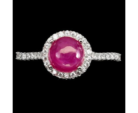 A 925 silver cluster ring set with a cabochon cut ruby and white stones, (P).