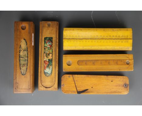 A group of five vintage wooden pencil cases.