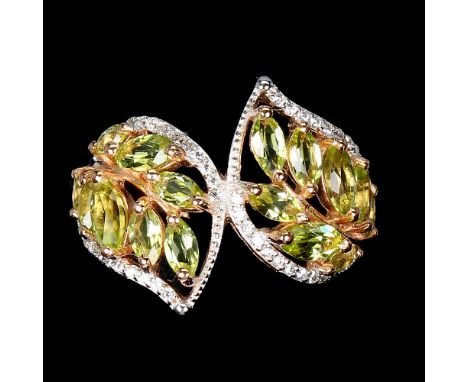 A 925 silver rose gold gilt ring set with marquise cut peridots and white stones, (Q).