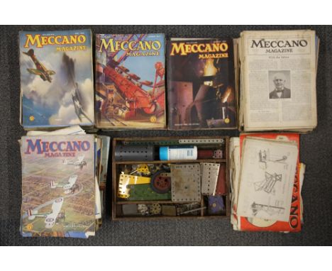 A quantity of vintage Meccano with instructions and a large quantity of 1930's and 40's Meccano magazines.