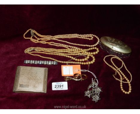 A small quantity of jewellery including a simulated pearl necklace with 9ct fastening, three and four strand simulated pearl 