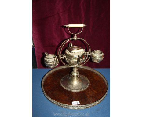 A plated teapot and milk jug on revolving Tray. 