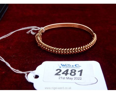 A 15 carat gold plaited design bangle. 10g (approx).