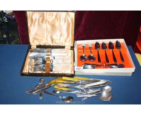 A quantity of cutlery including a boxed set of knives and forks with Mother of Pearl handles, spoons etc.