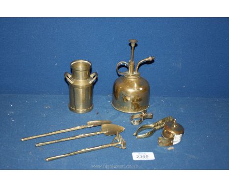 A miniature brass milk churn and contents of garden tools, brass measuring tape, sprayer and nut crackers.