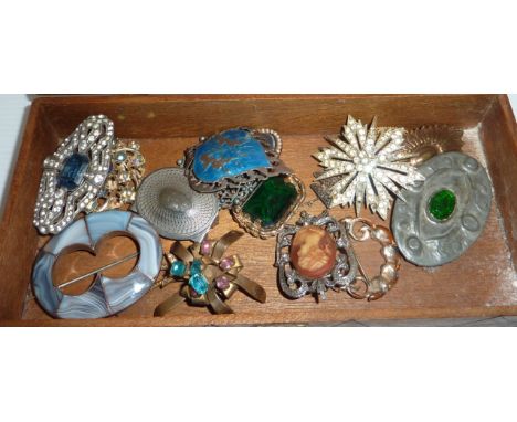 Small wooden box containing brooches, including Indian silver and enamel