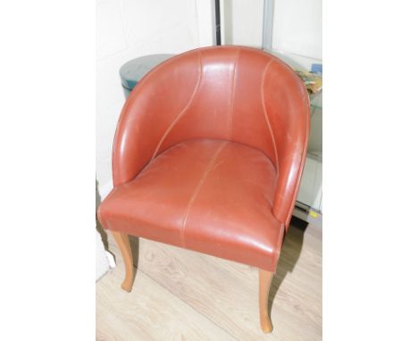 Set of four leather tub style chairs on light wood supports