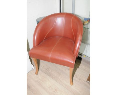 Set of four leather tub style chairs on light wood supports