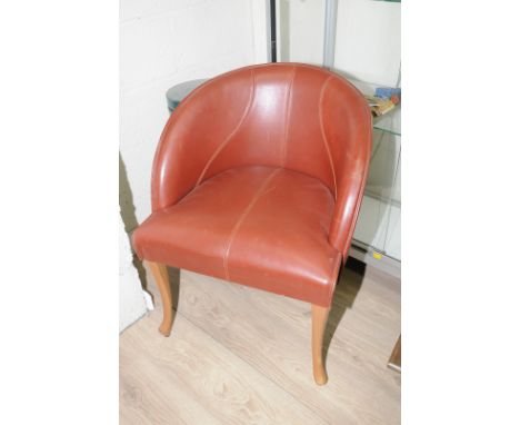 Set of four leather tub style chairs on light wood supports