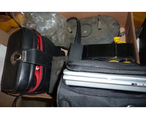Box containing selection of bulk film loaders, 35mm film developer, Canon AE 1 camera and lenses