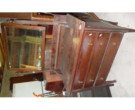 Oak dressing chest with raised mirror back above three drawers 