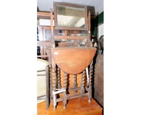 Oak drop leaf table on barley twist supports, brass topped table and an oak dressing table mirror