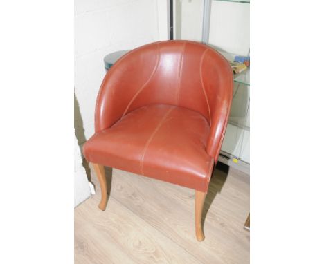 Set of four leather tub style chairs on light wood supports