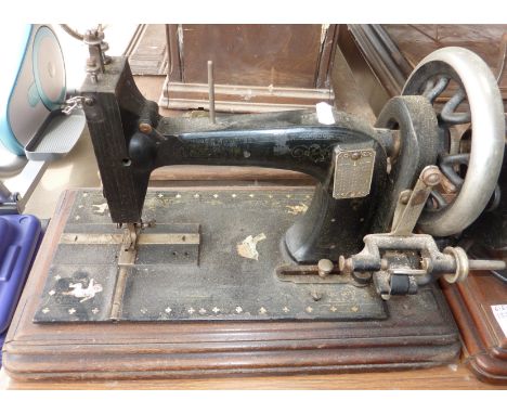Unusual vintage hand sewing machine the base with inset mother of pearl detail and Oriental scenes