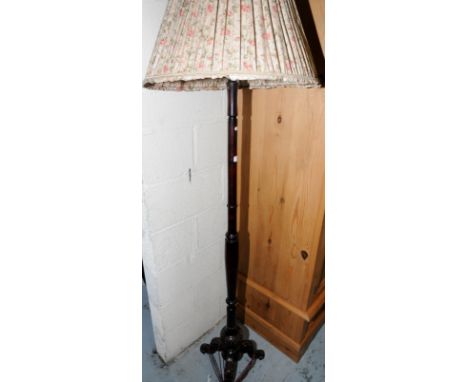 Mahogany standard lamp with turned column and three out splayed supports with carved detail