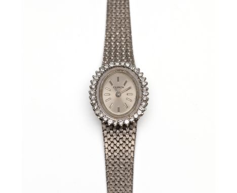 Nezach, 18 kt. witgouden mechanisch damespolshorloge, jaren '60. Met ovale wijzerplaat, de lunette bezet met briljant geslepe
