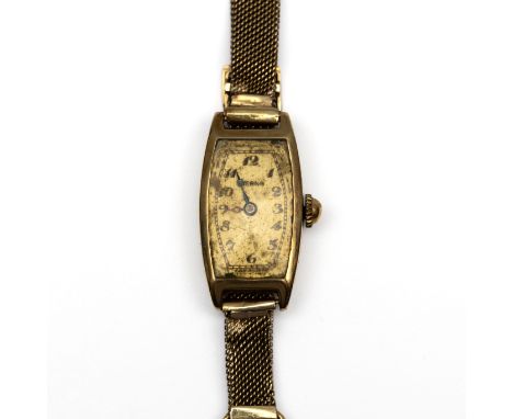 Eterna, 14 kt. gouden mechanisch dames polshorloge, Art Deco. De wijzerplaat tonneauvormig en bezet met Arabische cijfers. Aa
